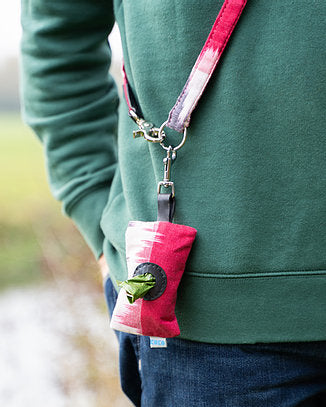 purple poo bag carrier